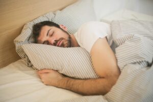 man sleeping and wearing an El Paso nightguard