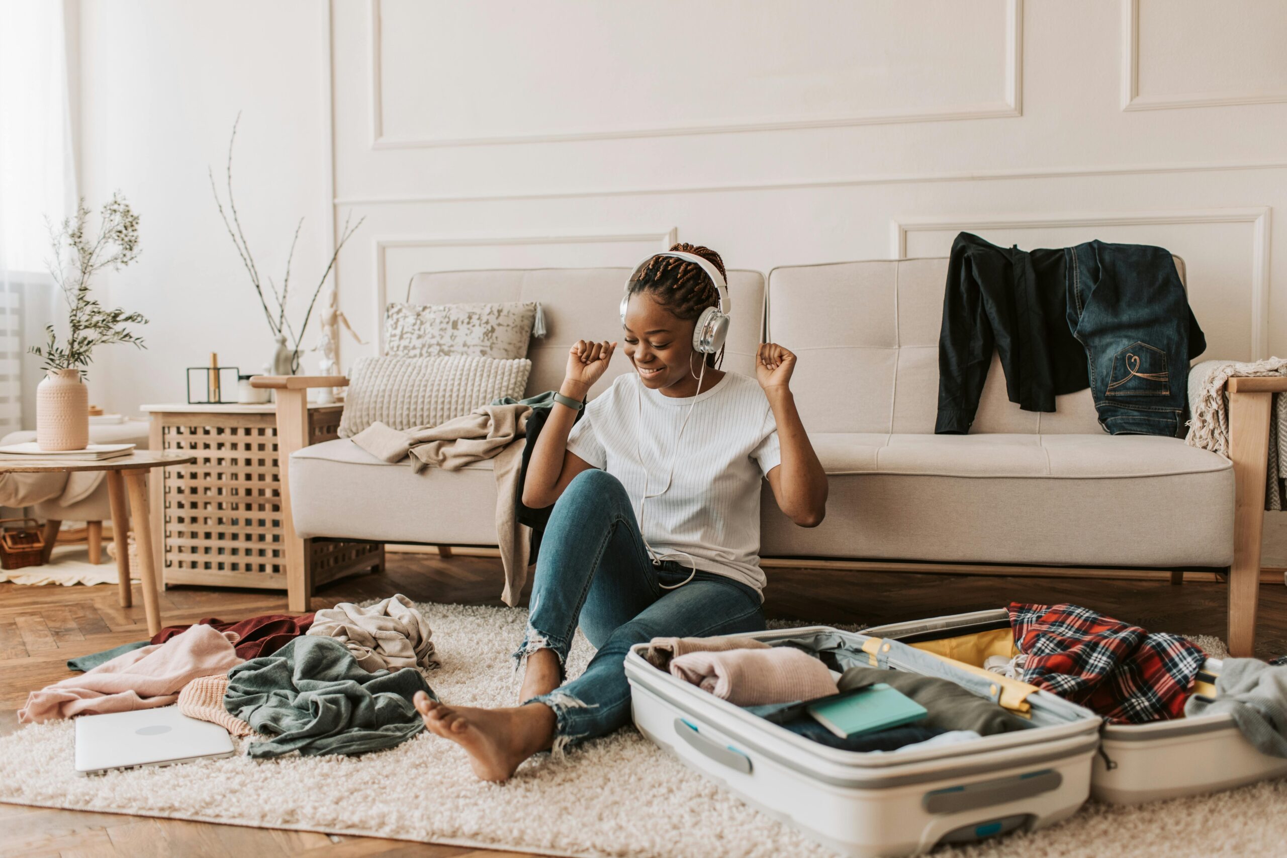 woman packing for her vacation after starting Invisalign near me + El Paso