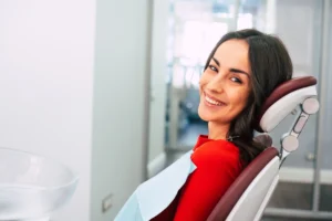 lady on a dentist chair smiling after her appointment